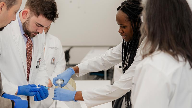 TTUHSC surgery residents at TTUHSC Amarillo practicing hands-on procedural training with faculty guidance in a clinical skills lab.