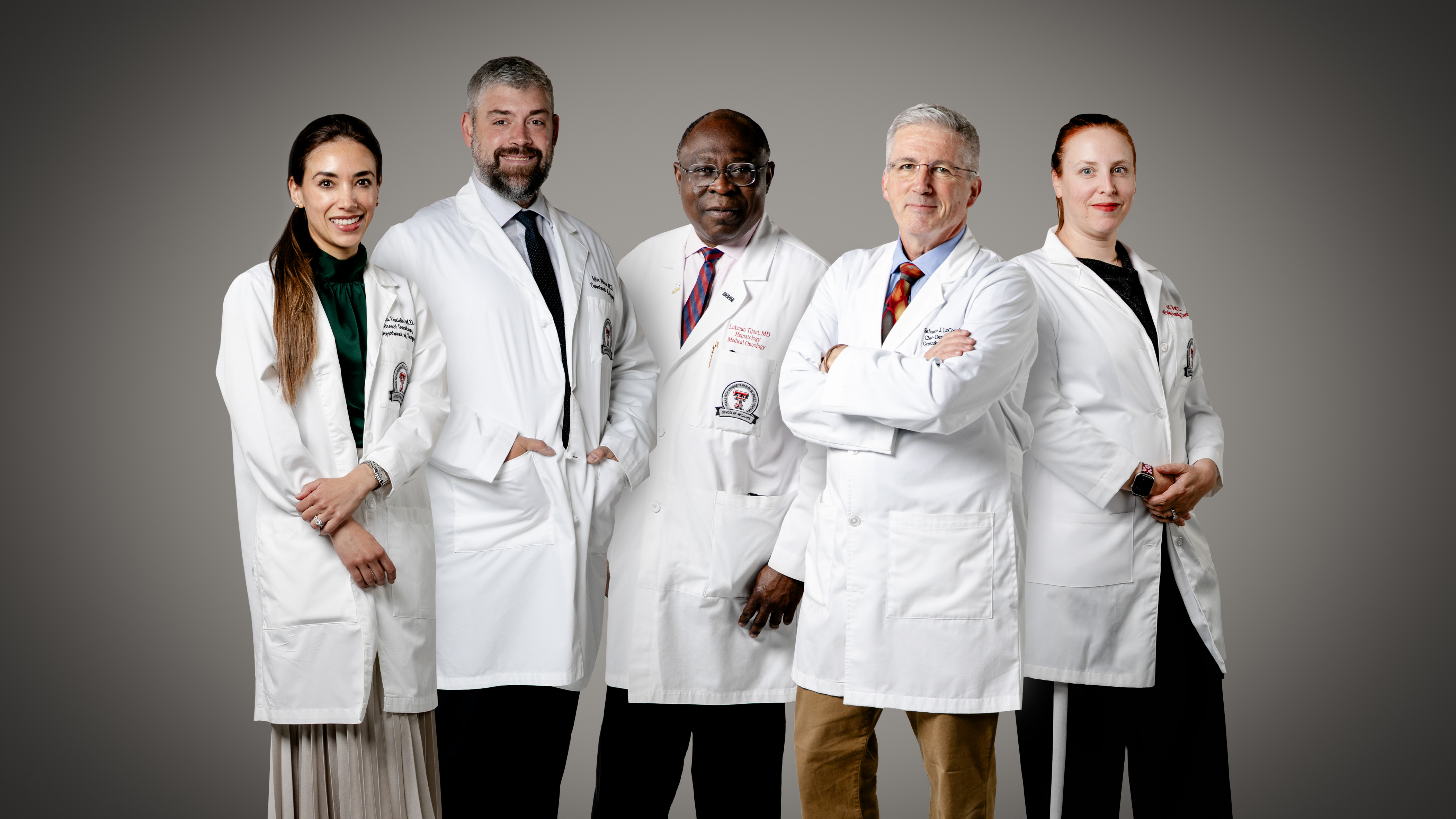 Group of expert cancer physicians facing camera